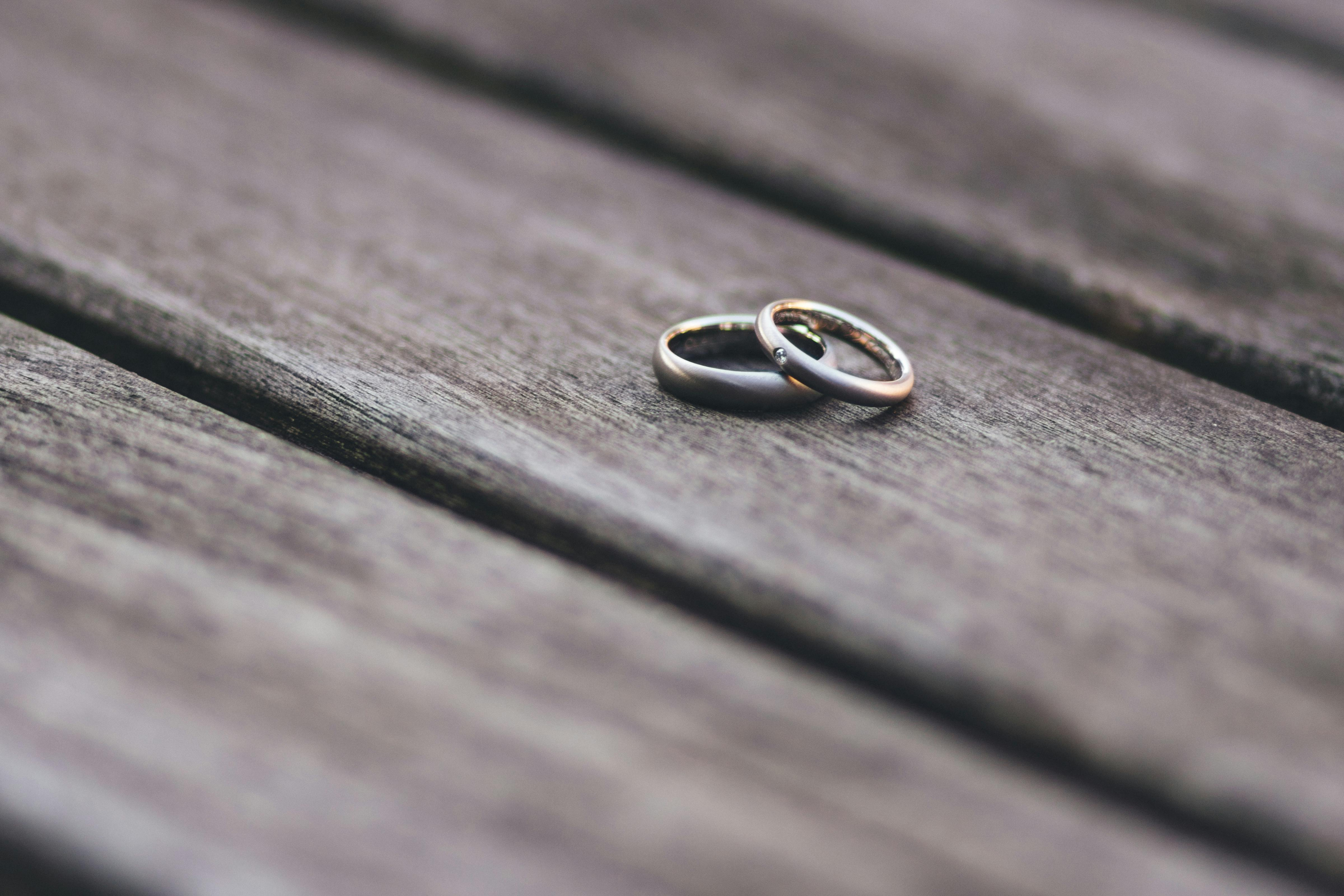 Close up of married couple's hands giving knuckles.